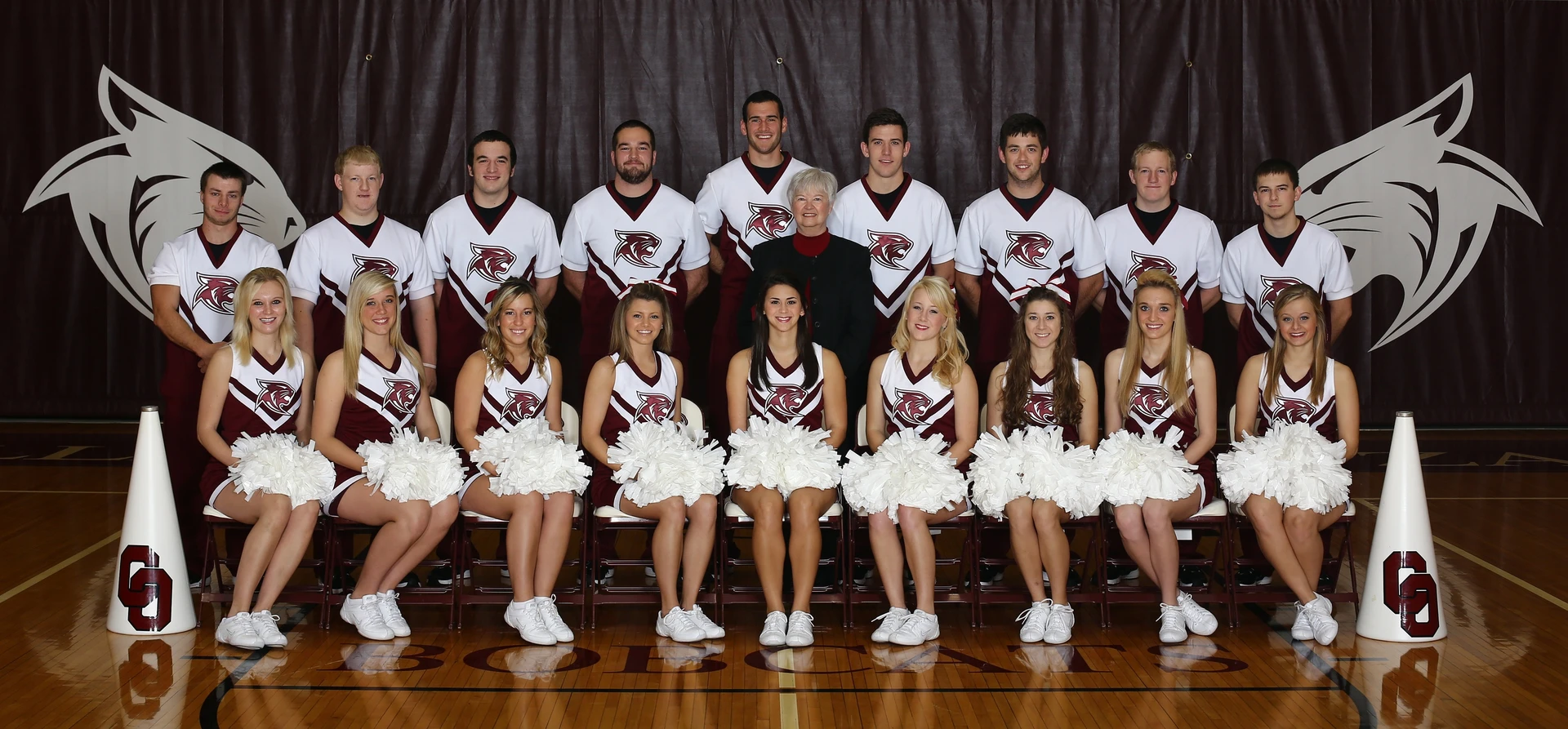 Marty Waller with cheerleading team 